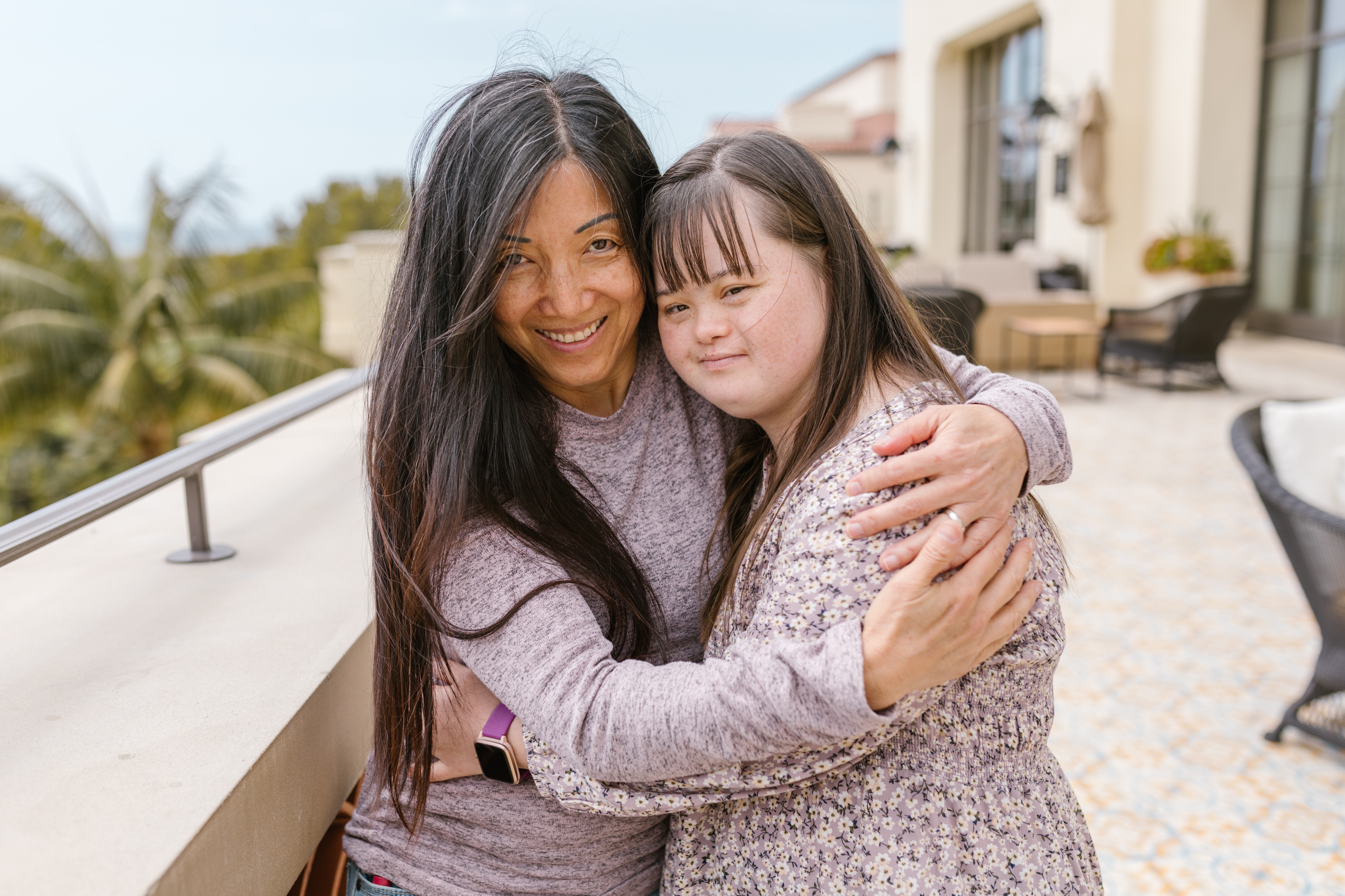 Woman hugging autistic girl